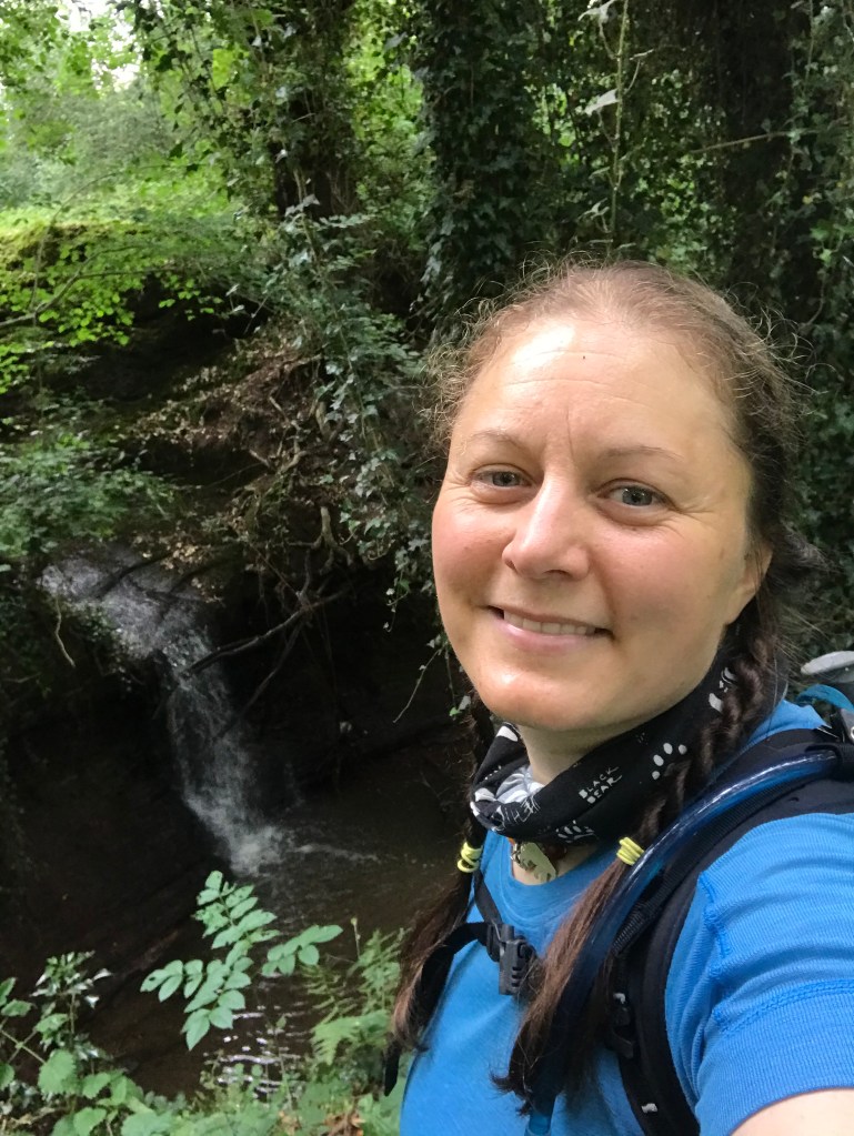 A selfie by a small waterfall