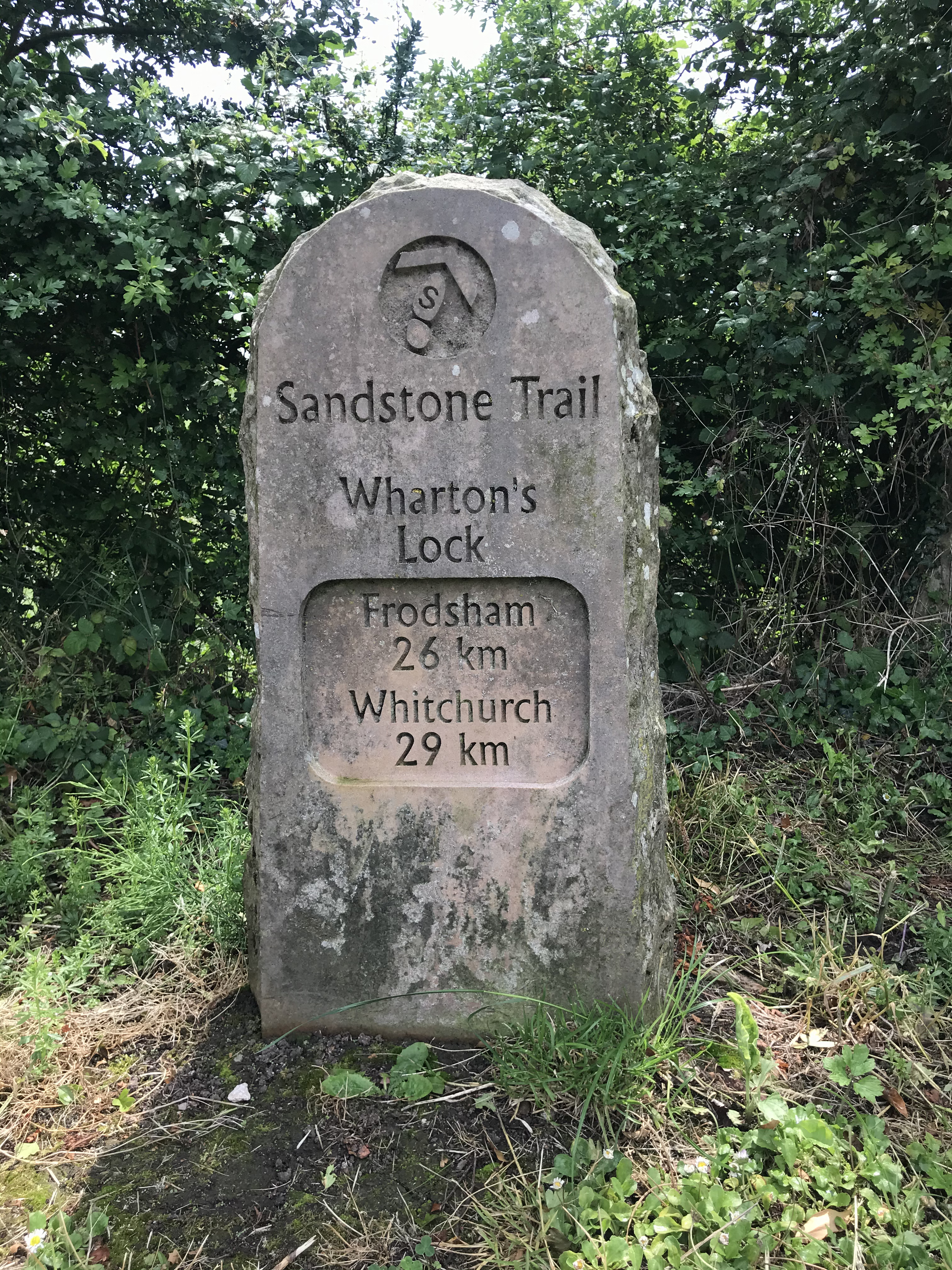 A milestone at Wharton's lock. Frodsham 26 km, Whitchurch 29 km