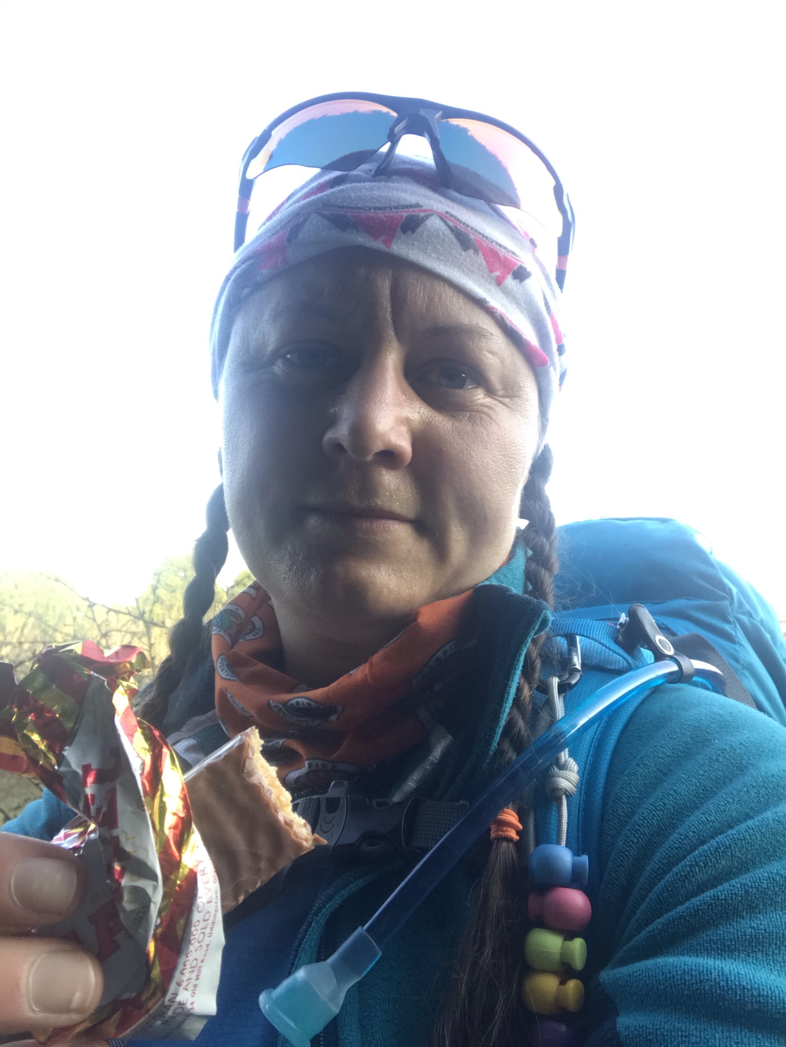 A selfie of me in walking kit eating a tunnocks caramel wafer