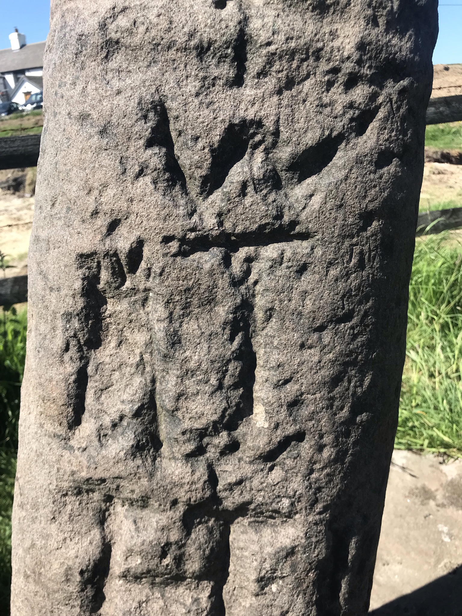 Worn carvings on a stone pillar